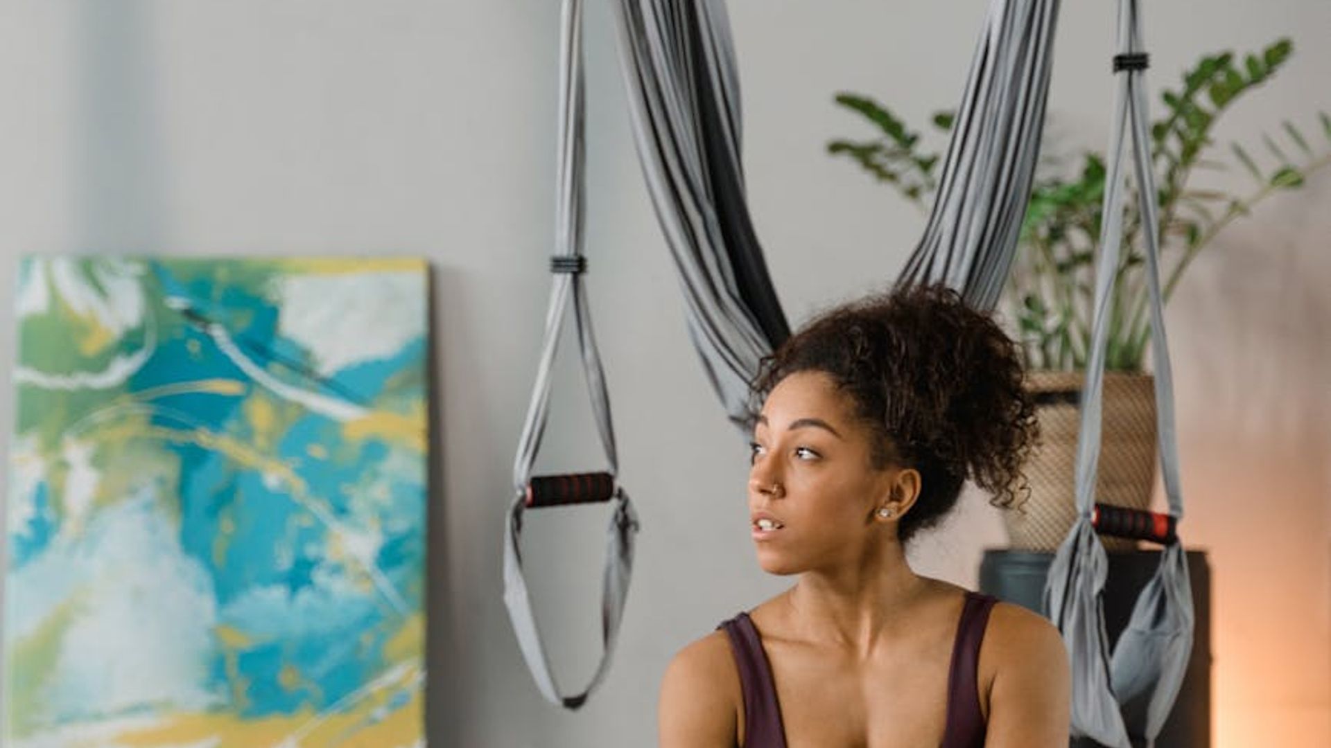 Atmospheric yoga studio with soft lighting and natural elements.